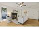 Bright living room with hardwood floors, a black fireplace, comfortable seating, and lots of light at 1605 Valley Run, Durham, NC 27707