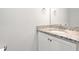 Neutral bathroom showcasing a granite countertop and sink with white vanity at 1711 Memory Ln, Burlington, NC 27217