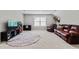 Large bonus room with a media center, leather seating, and cozy decor, great for Gathering time or entertaining guests at 1711 Memory Ln, Burlington, NC 27217
