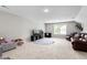 Spacious bonus room perfect for entertainment and relaxation, featuring plush seating, a TV, and ample space at 1711 Memory Ln, Burlington, NC 27217