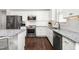 Modern kitchen featuring stainless steel appliances, granite counters, and white subway tile backsplash at 1711 Memory Ln, Burlington, NC 27217