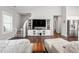 Spacious living room featuring hardwood floors, comfortable seating, and a view into the open kitchen at 1711 Memory Ln, Burlington, NC 27217
