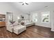 Cozy living room featuring hardwood floors, neutral decor, and an abundance of natural light through the windows at 1711 Memory Ln, Burlington, NC 27217