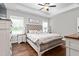 Comfortable main bedroom boasts a tray ceiling, neutral tones, and plenty of natural light at 1711 Memory Ln, Burlington, NC 27217