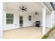 Covered patio with dual ceiling fans, ready for outdoor dining and relaxation, featuring a built-in grill at 1711 Memory Ln, Burlington, NC 27217