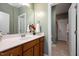 Bathroom with modern vanity, large mirror, and adjacent toilet and shower at 1724 Capstone Dr, Durham, NC 27713