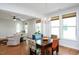 Bright dining room with chandelier, hardwood floors, and large windows at 1724 Capstone Dr, Durham, NC 27713