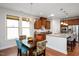 Open-concept kitchen with granite countertops, stainless steel appliances, and a breakfast bar at 1724 Capstone Dr, Durham, NC 27713