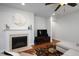 Living room with fireplace, hardwood floors, and a decorative mantle with marble surround at 1724 Capstone Dr, Durham, NC 27713