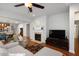 Inviting living room featuring a cozy fireplace and an open floor plan at 1724 Capstone Dr, Durham, NC 27713