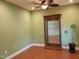 Versatile office space with hardwood floors and a contemporary display cabinet at 1724 Capstone Dr, Durham, NC 27713