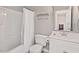 A clean bathroom with a tub, toilet, sink, and white cabinets provides essential amenities at 19 Knightsbridge Ct, Durham, NC 27707
