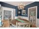 Dining room showcasing an open layout, a round wooden table, and elegant white trim at 19 Knightsbridge Ct, Durham, NC 27707