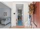 Foyer with hardwood floors leading to a well-lit hallway and a glimpse of the living room at 19 Knightsbridge Ct, Durham, NC 27707
