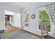 Bright living room with hardwood floors, light blue walls, and a view into the dining room and front entry at 19 Knightsbridge Ct, Durham, NC 27707