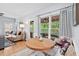 Comfortable living room with a dining nook and a view to the screened in porch at 19 Knightsbridge Ct, Durham, NC 27707