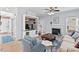 Cozy living room with a fireplace, built-in shelving unit, comfortable seating, and natural light from the window at 19 Knightsbridge Ct, Durham, NC 27707