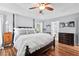 Large primary bedroom featuring trey ceiling, wood flooring, and neutral wall color with an en suite bath at 19 Knightsbridge Ct, Durham, NC 27707