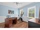 Office space features desk and workout area with natural light and neutral color scheme at 19 Knightsbridge Ct, Durham, NC 27707