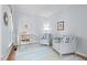 Comfortable home office with armchairs, a writing desk, and soft natural light at 19 Knightsbridge Ct, Durham, NC 27707