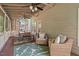 Inviting screened porch featuring comfortable seating, a dining area, and a relaxing atmosphere overlooking the outdoors at 19 Knightsbridge Ct, Durham, NC 27707