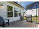 Outdoor deck with a grill and comfortable seating, ideal for entertaining or relaxing outdoors at 1928 Vandiver Way, Apex, NC 27523