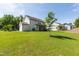 Sprawling backyard with lush grass and mature trees provides a serene and private outdoor retreat at 1928 Vandiver Way, Apex, NC 27523