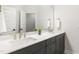 Elegant bathroom featuring double vanity with granite countertop, modern sinks, and a large mirror reflecting the space at 1928 Vandiver Way, Apex, NC 27523