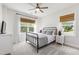 Cozy bedroom featuring neutral colors, stylish bed frame, and windows offering plenty of natural light at 1928 Vandiver Way, Apex, NC 27523