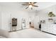 Comfortable bedroom with a ceiling fan, neutral tones, and ample storage, with view into adjacent room at 1928 Vandiver Way, Apex, NC 27523