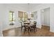 Cozy breakfast nook with a round table, natural light, and a view of the screened-in porch at 1928 Vandiver Way, Apex, NC 27523