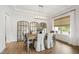 Elegant dining room with a stylish chandelier, decorative mirrors, and comfortable seating for formal gatherings at 1928 Vandiver Way, Apex, NC 27523