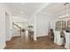 Elegant foyer with high ceilings, hardwood floors, and a view into the open-concept living and dining areas at 1928 Vandiver Way, Apex, NC 27523
