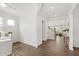 Spacious foyer with hardwood floors and elegant wainscoting, leading to the main living areas of the home at 1928 Vandiver Way, Apex, NC 27523