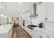 Bright kitchen featuring white cabinets, stainless steel appliances, and stylish countertops at 1928 Vandiver Way, Apex, NC 27523