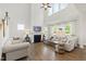 Spacious living room with high ceilings, a fireplace, and lots of natural light at 1928 Vandiver Way, Apex, NC 27523
