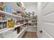 Pantry with ample shelving, ideal for organized storage of food and kitchen essentials at 1928 Vandiver Way, Apex, NC 27523