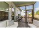 Relaxing screened porch with a comfortable daybed and outdoor seating, perfect for enjoying the weather at 1928 Vandiver Way, Apex, NC 27523