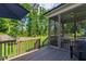 Inviting screened porch and deck offer a private, shaded space for relaxing and enjoying the backyard view at 1928 Vandiver Way, Apex, NC 27523