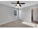 Bright bedroom with neutral walls, carpeted floors, and a ceiling fan at 20 Sugarpine Trl, Clayton, NC 27520
