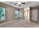 Spacious bedroom with neutral carpet, tray ceilings, and two closets offering ample storage at 20 Sugarpine Trl, Clayton, NC 27520
