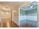 Inviting home hallway with hardwood floors and decorative trim at 20 Sugarpine Trl, Clayton, NC 27520