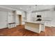 Modern kitchen with granite countertops, stainless steel appliances, and ample cabinet space at 20 Sugarpine Trl, Clayton, NC 27520