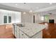 Granite countertop island in the kitchen features stainless steel sink at 20 Sugarpine Trl, Clayton, NC 27520