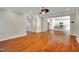 Spacious living room with hardwood floors seamlessly flowing into the kitchen at 20 Sugarpine Trl, Clayton, NC 27520