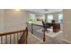 Office with wood desk and black chair. A carpeted floor adds comfort at 20 Sugarpine Trl, Clayton, NC 27520
