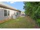This backyard features a well-maintained lawn, storage unit, and patio space at 202 Verrazano Pl, Clayton, NC 27520
