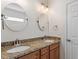 Bathroom with double sink vanity featuring granite countertop and modern fixtures at 202 Verrazano Pl, Clayton, NC 27520