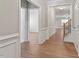 Elegant entryway featuring hardwood floors, wainscoting, and a staircase at 202 Verrazano Pl, Clayton, NC 27520
