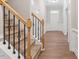 Inviting entryway boasts wood floors, white trim, and a staircase at 202 Verrazano Pl, Clayton, NC 27520